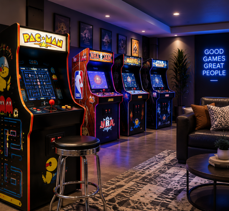 Classic arcade machines in a modern home game room with lounge seating and neon lighting