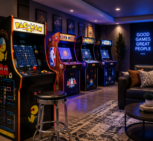 Classic arcade machines in a modern home game room with lounge seating and neon lighting