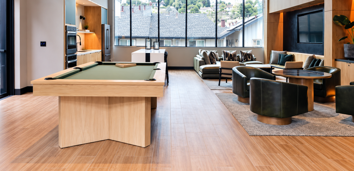 Side angle of the Contemporary Infinity Pool Table showcasing its clean-lined wood rails and geometric pedestal supports.