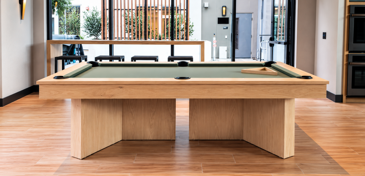 Front view of the Contemporary Infinity Pool Table with green playing felt and a contemporary wood base.