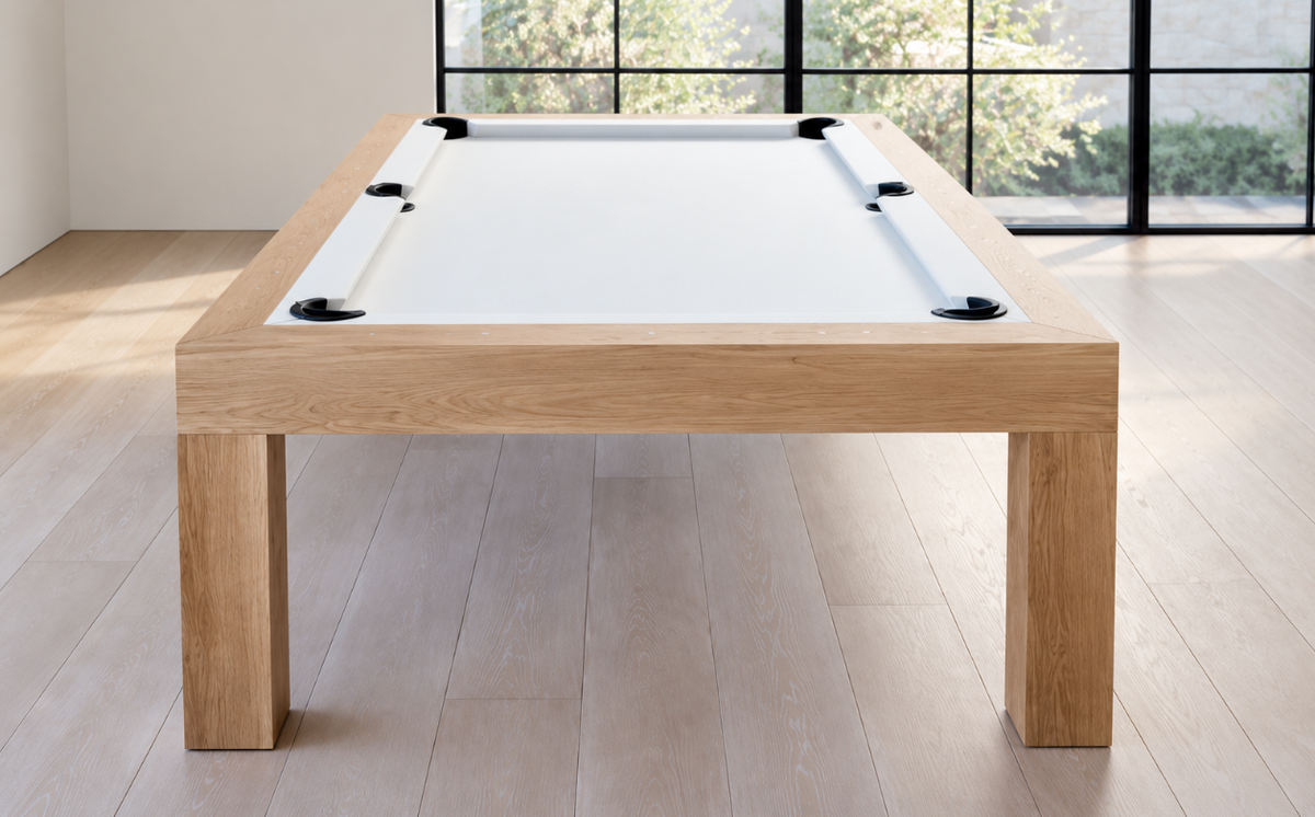 Front view of the natural white oak Rift pool table showing its white felt, wide wood apron, and square legs.
