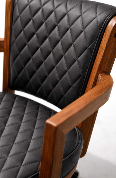 Close-up of diamond-quilted black upholstery on the Prohibition gaming and dining chair