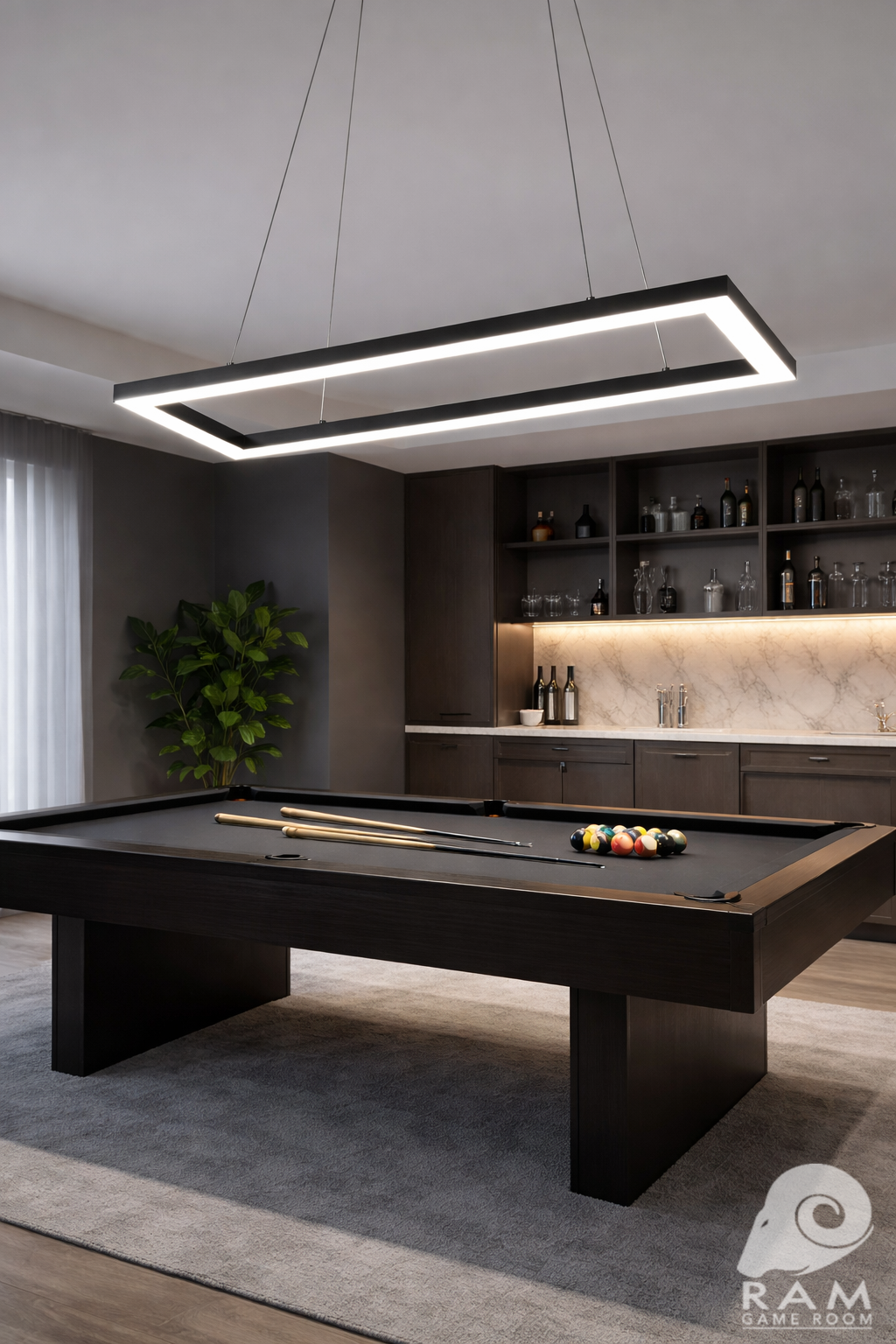 47-inch rectangular LED game table light in matte black illuminated above a pool table in a modern game room